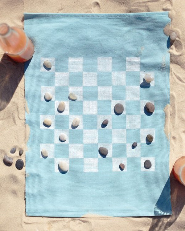 DIY checkers game on the beach 